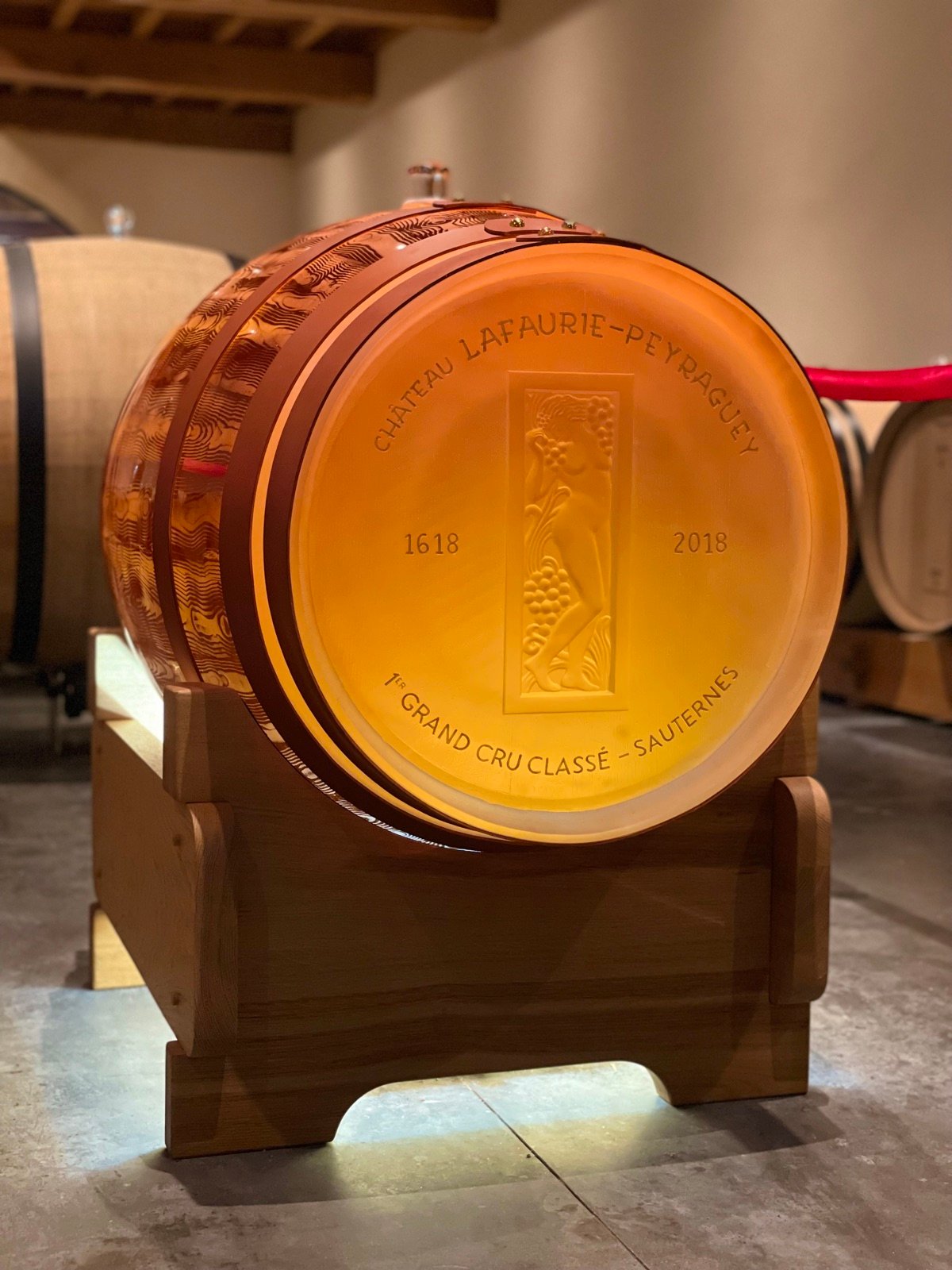 A barrel of Château Lafaurie-Peyraguey, lit from inside