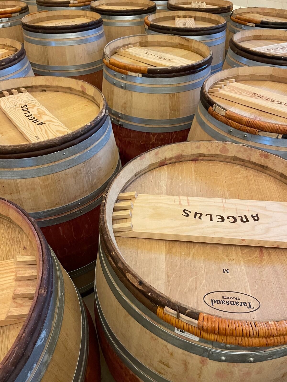 New oak barrels stamped Angélus